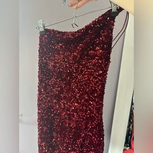 Short red sequence dress.